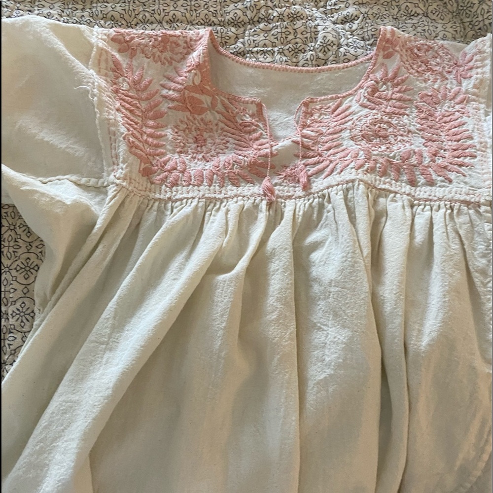 Cotton baby doll top with embroidered design